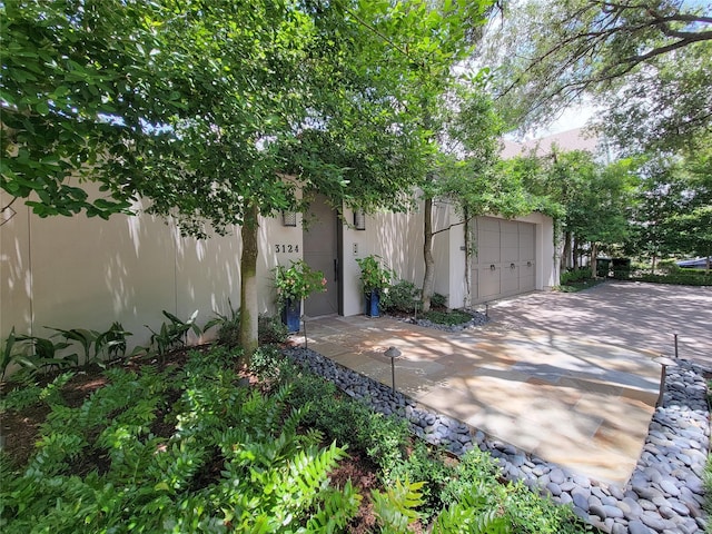 3124 Mid Ln, Houston, TX 77027 - view of patio / terrace featuring a garage