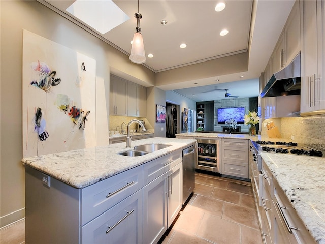 3124 Mid Ln, Houston, TX 77027 - kitchen with wine cooler, under cabinet range hood, tasteful backsplash, gas stovetop, and recessed lighting