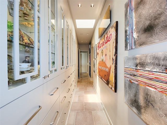 3124 Mid Ln, Houston, TX 77027 - hallway with recessed lighting and light stone finish flooring