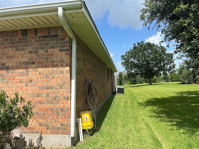 14027 Ambrose St, Houston, TX 77045 - view of side of property featuring brick siding and a yard