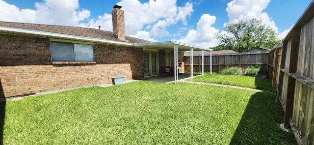 14027 Ambrose St, Houston, TX 77045 - rear view of house with brick siding, a chimney, a fenced backyard, and a patio
