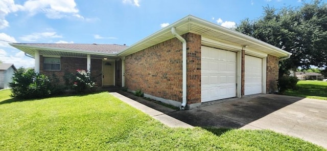 14027 Ambrose St, Houston, TX 77045 - view of side of property with a lawn, brick siding, an attached garage, and concrete driveway
