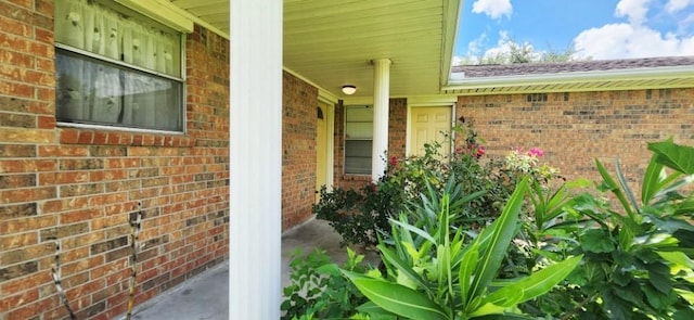 14027 Ambrose St, Houston, TX 77045 - property entrance with brick siding and a porch