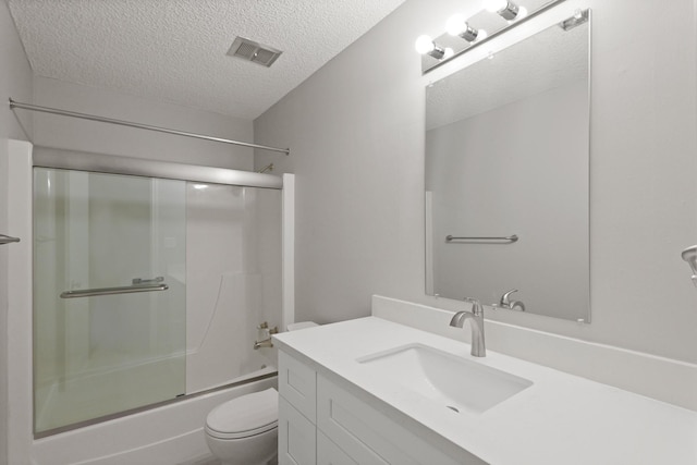 2212 Shadowdale Dr Unit 358, Houston, TX 77043 - full bathroom featuring vanity, bath / shower combo with glass door, and a textured ceiling