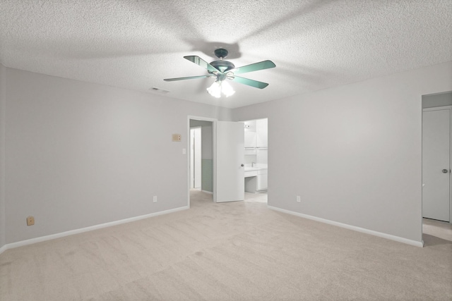 2212 Shadowdale Dr Unit 358, Houston, TX 77043 - unfurnished bedroom with light colored carpet, a textured ceiling, ceiling fan, and ensuite bathroom