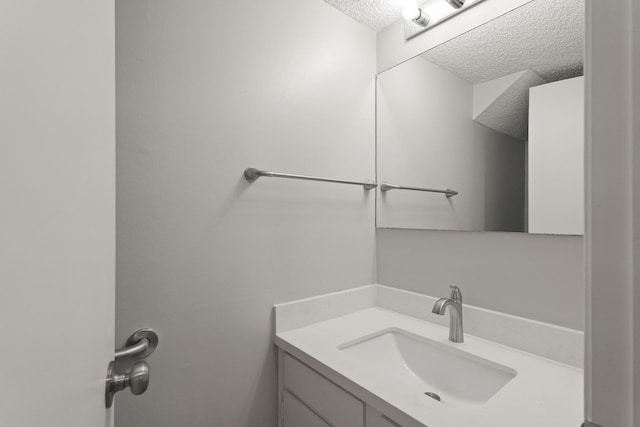2212 Shadowdale Dr Unit 358, Houston, TX 77043 - bathroom featuring a textured ceiling and vanity