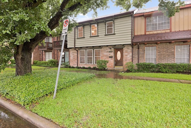 2212 Shadowdale Dr Unit 358, Houston, TX 77043 - view of property with brick siding and a front yard