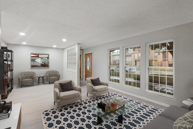 2212 Shadowdale Dr Unit 358, Houston, TX 77043 - living area featuring recessed lighting, a textured ceiling, and wood finished floors