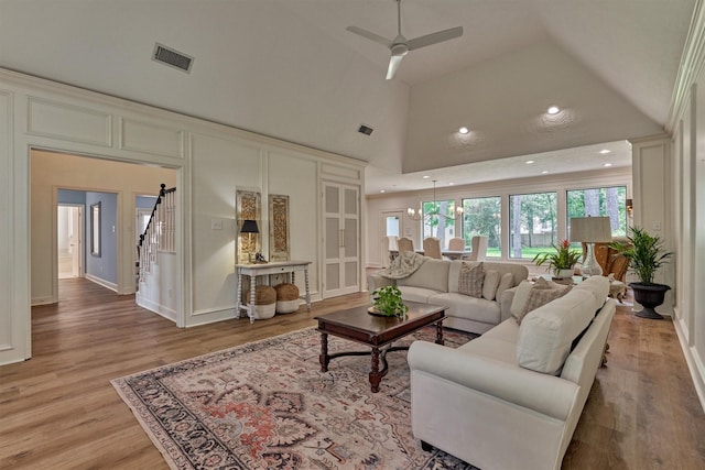 23119 Hampton Forest Ln, Spring, TX 77389 - living area with light wood-style flooring, ceiling fan, recessed lighting, and high vaulted ceiling