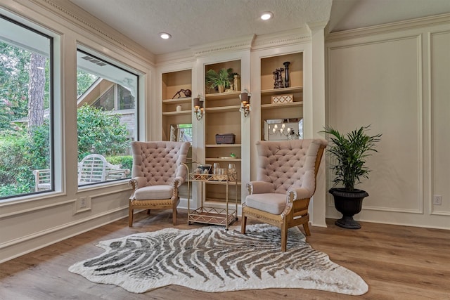 23119 Hampton Forest Ln, Spring, TX 77389 - sitting room featuring a textured ceiling, wood finished floors, built in features, and recessed lighting