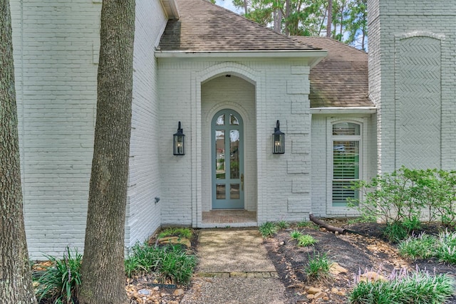 23119 Hampton Forest Ln, Spring, TX 77389 - property entrance with a shingled roof, french doors, and brick siding