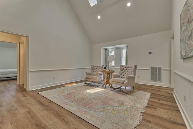 23119 Hampton Forest Ln, Spring, TX 77389 - living area with high vaulted ceiling, wood finished floors, and recessed lighting