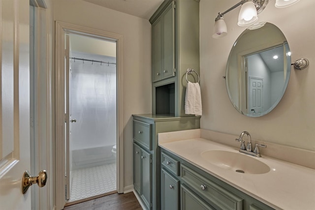23119 Hampton Forest Ln, Spring, TX 77389 - full bath featuring vanity, wood finished floors, and shower / bathtub combination with curtain