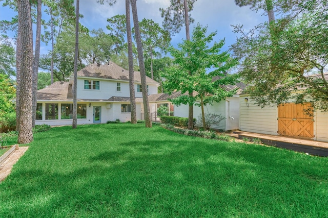 23119 Hampton Forest Ln, Spring, TX 77389 - back of house with a lawn and a shingled roof