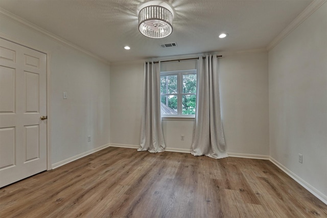 23119 Hampton Forest Ln, Spring, TX 77389 - unfurnished room with a chandelier, wood finished floors, crown molding, and recessed lighting