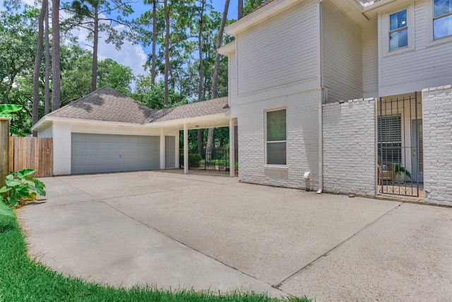 23119 Hampton Forest Ln, Spring, TX 77389 - view of front facade featuring an attached garage, driveway, and brick siding