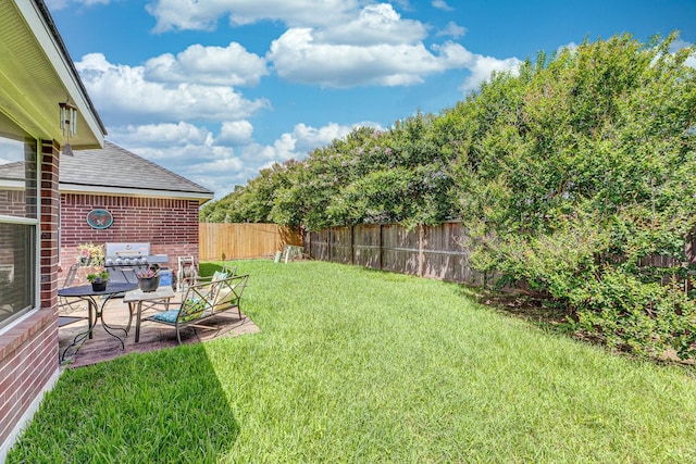 8114 Rushing Stream Ct, Tomball, TX 77375 - fenced backyard with a patio area