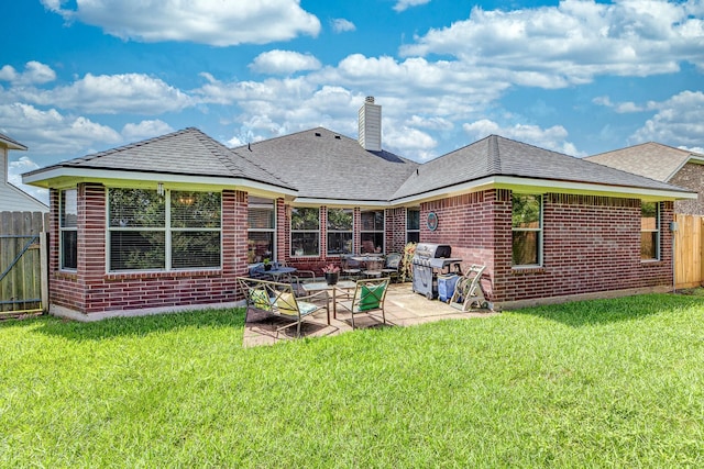 8114 Rushing Stream Ct, Tomball, TX 77375 - rear view of property with a chimney, brick siding, a patio, and roof with shingles