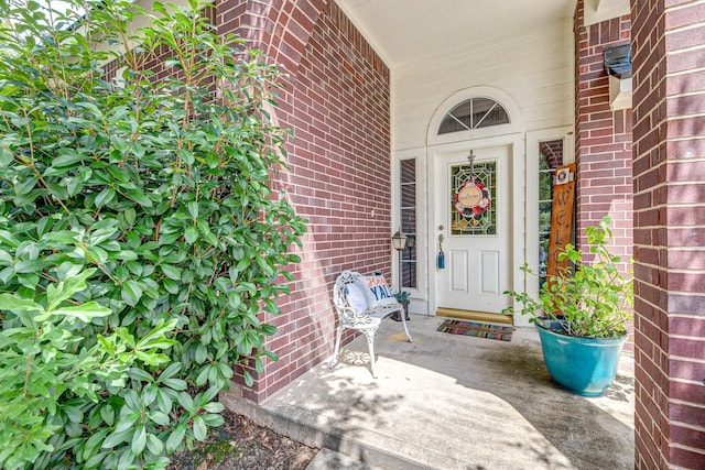 8114 Rushing Stream Ct, Tomball, TX 77375 - doorway to property with brick siding and covered porch