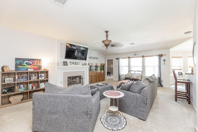 8114 Rushing Stream Ct, Tomball, TX 77375 - living area featuring ceiling fan, light carpet, and a tile fireplace