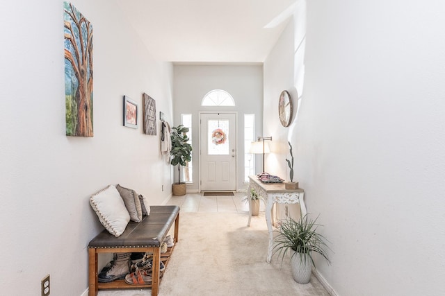 8114 Rushing Stream Ct, Tomball, TX 77375 - foyer featuring light tile patterned floors and light colored carpet