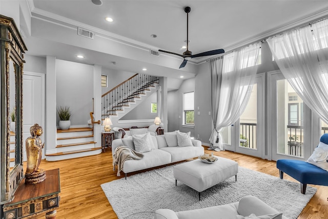 2206 Hilshire Glen Ct, Houston, TX 77080 - living room with crown molding, stairway, ceiling fan, wood finished floors, and recessed lighting