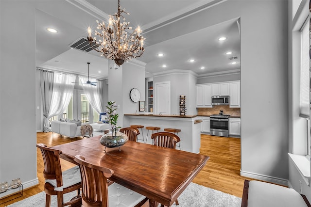 2206 Hilshire Glen Ct, Houston, TX 77080 - dining room featuring ornamental molding, light wood finished floors, a chandelier, ceiling fan, and recessed lighting