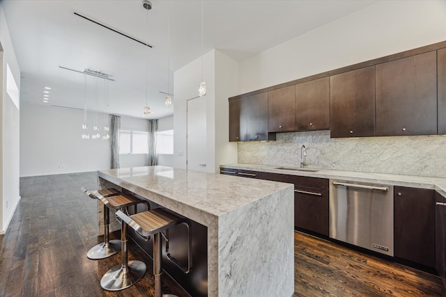 1728 Michigan St Unit C, Houston, TX 77006 - kitchen featuring dishwasher, dark brown cabinetry, tasteful backsplash, and a breakfast bar