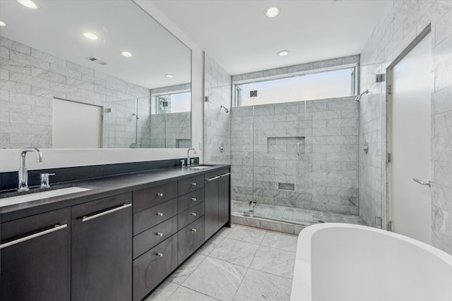 1728 Michigan St Unit C, Houston, TX 77006 - full bath featuring a stall shower, a freestanding bath, double vanity, recessed lighting, and marble finish floors
