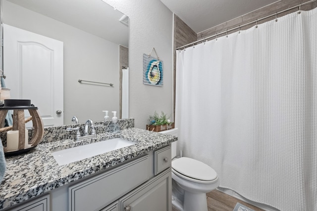 16863 Big Reed Dr, Humble, TX 77346 - bathroom featuring vanity, wood finished floors, and curtained shower