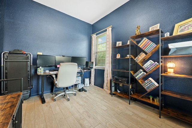 16863 Big Reed Dr, Humble, TX 77346 - office space with a textured wall, wood finished floors, and lofted ceiling