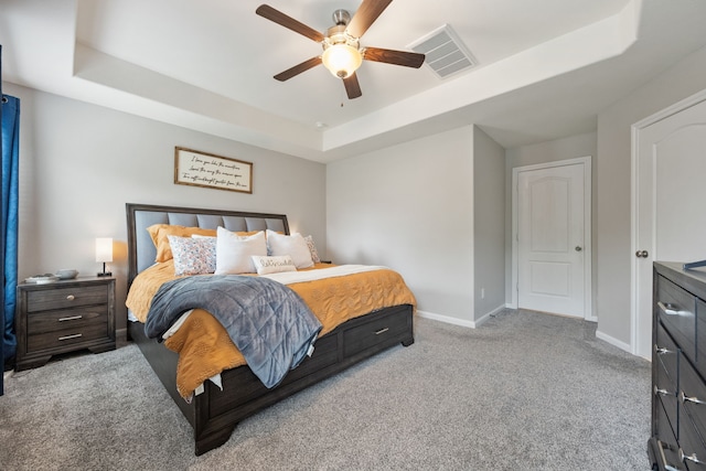 16863 Big Reed Dr, Humble, TX 77346 - carpeted bedroom featuring a raised ceiling and ceiling fan