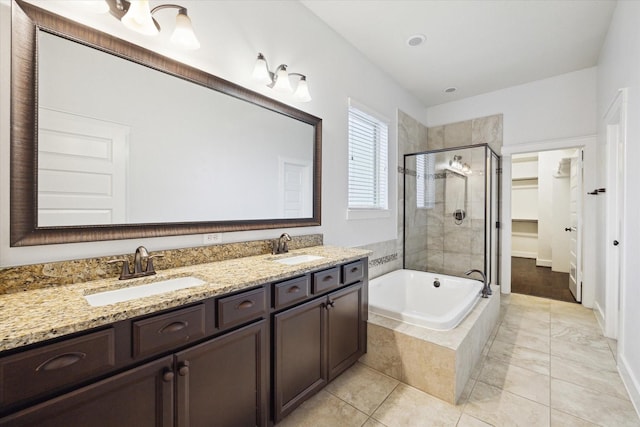 17011 Seminole Ridge Dr, Cypress, TX 77433 - full bath with a shower stall, double vanity, a garden tub, and a walk in closet