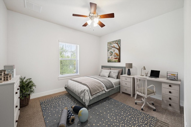 17011 Seminole Ridge Dr, Cypress, TX 77433 - carpeted bedroom with a desk and a ceiling fan