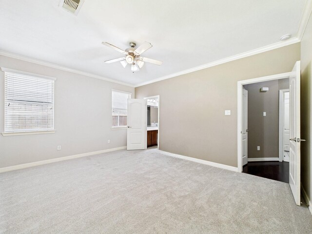 8122 Silver Lure Dr, Humble, TX 77346 - unfurnished bedroom with crown molding, carpet floors, a ceiling fan, and connected bathroom