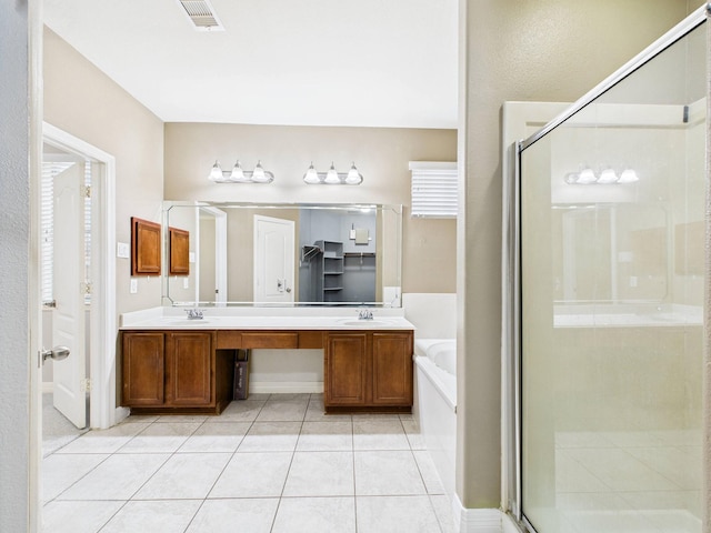 8122 Silver Lure Dr, Humble, TX 77346 - full bath with a garden tub, a shower stall, double vanity, and tile patterned flooring