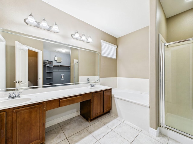 8122 Silver Lure Dr, Humble, TX 77346 - full bathroom with a garden tub, double vanity, a shower stall, and tile patterned flooring