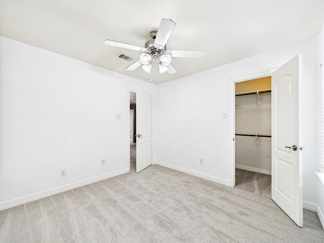 8122 Silver Lure Dr, Humble, TX 77346 - unfurnished bedroom featuring carpet floors, a walk in closet, ceiling fan, and a closet