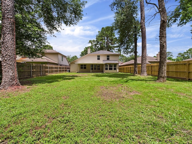8122 Silver Lure Dr, Humble, TX 77346 - back of house featuring a chimney and a fenced backyard