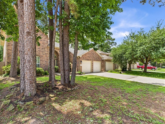 8122 Silver Lure Dr, Humble, TX 77346 - view of front of property featuring brick siding, a garage, and driveway