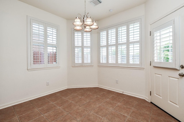 150 Nina Ln, Stafford, TX 77477 - unfurnished dining area featuring plenty of natural light, a chandelier, and tile patterned floors