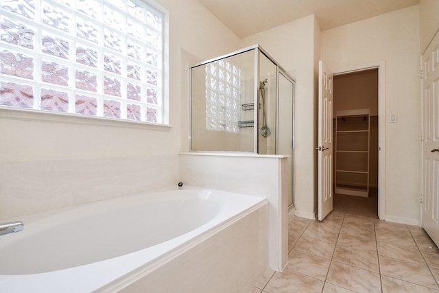 150 Nina Ln, Stafford, TX 77477 - bathroom featuring a shower stall, a garden tub, and plenty of natural light