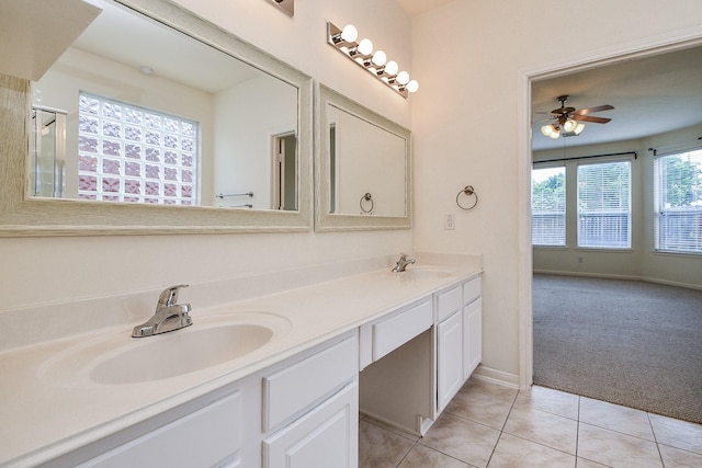150 Nina Ln, Stafford, TX 77477 - full bathroom featuring double vanity, tile patterned floors, a ceiling fan, and a shower with shower door