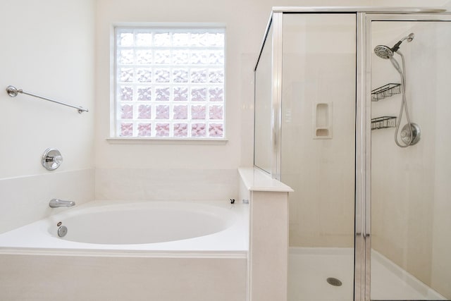 150 Nina Ln, Stafford, TX 77477 - full bath with a shower stall, a bath, and healthy amount of natural light