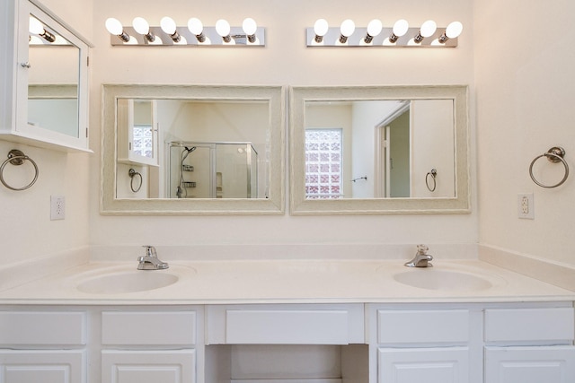 150 Nina Ln, Stafford, TX 77477 - bathroom featuring double vanity and a stall shower