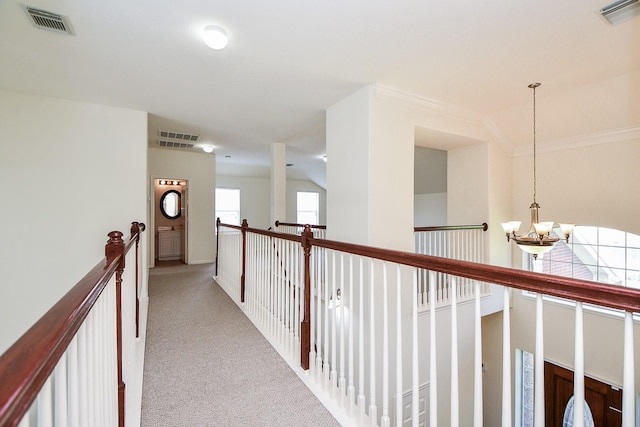 150 Nina Ln, Stafford, TX 77477 - corridor with a chandelier, carpet flooring, and ornamental molding