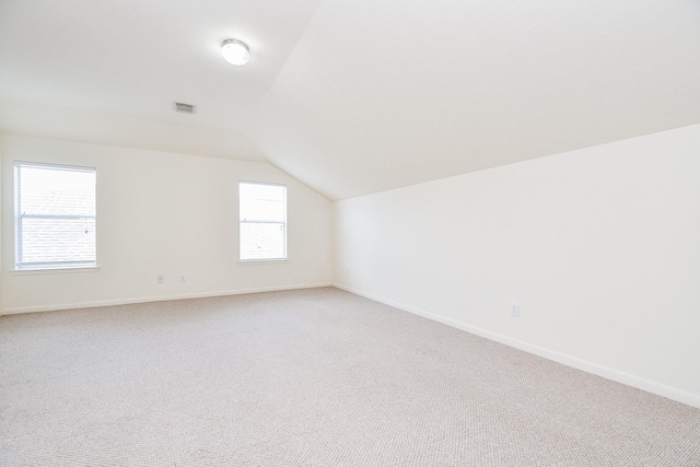 150 Nina Ln, Stafford, TX 77477 - additional living space with lofted ceiling and light colored carpet