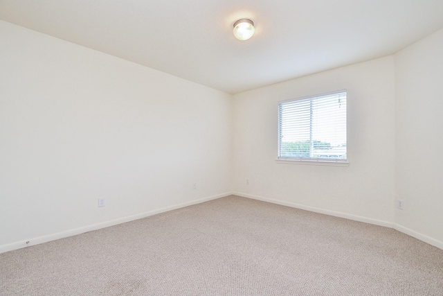 150 Nina Ln, Stafford, TX 77477 - carpeted empty room featuring baseboards