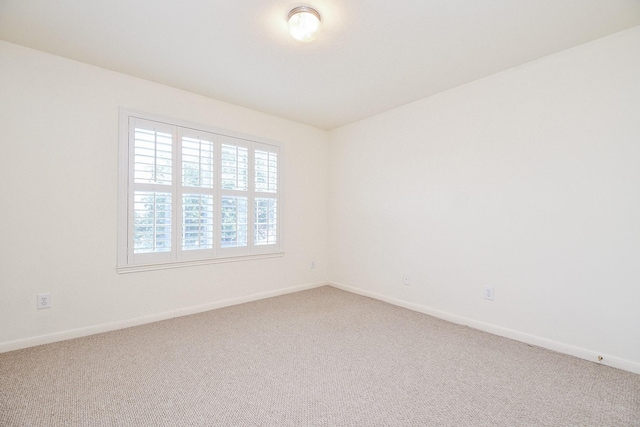 150 Nina Ln, Stafford, TX 77477 - carpeted spare room featuring baseboards