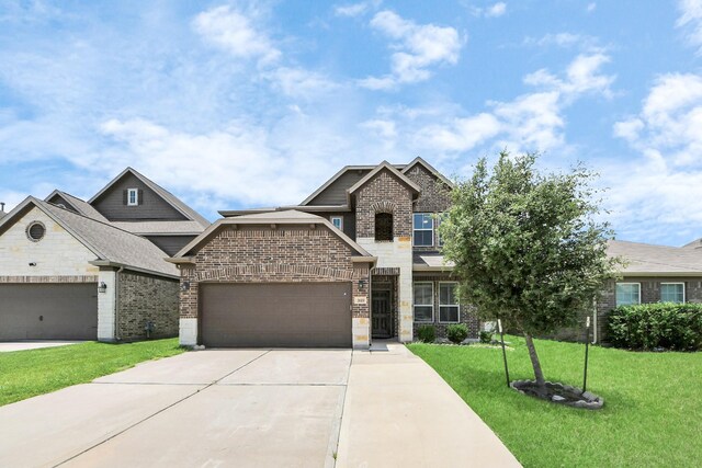 3619 Barkers Run Dr, Houston, TX 77084 - view of front facade featuring brick siding, concrete driveway, a front lawn, and an attached garage